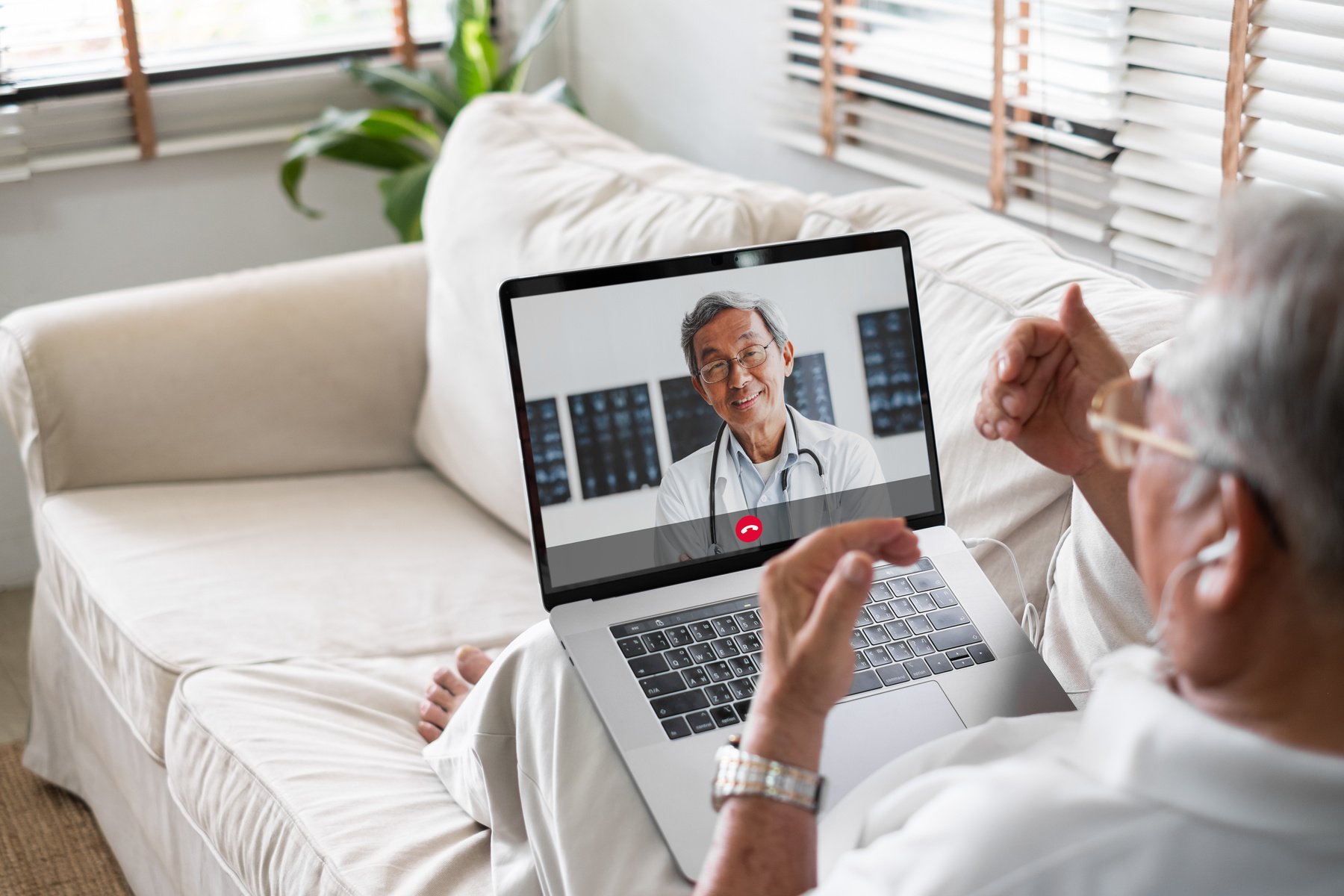 Asian senior video call with doctor telemedicine telehealth concept